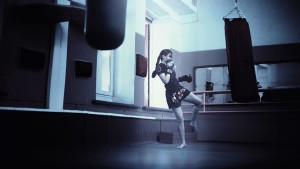 a woman Practicing Muay Thai