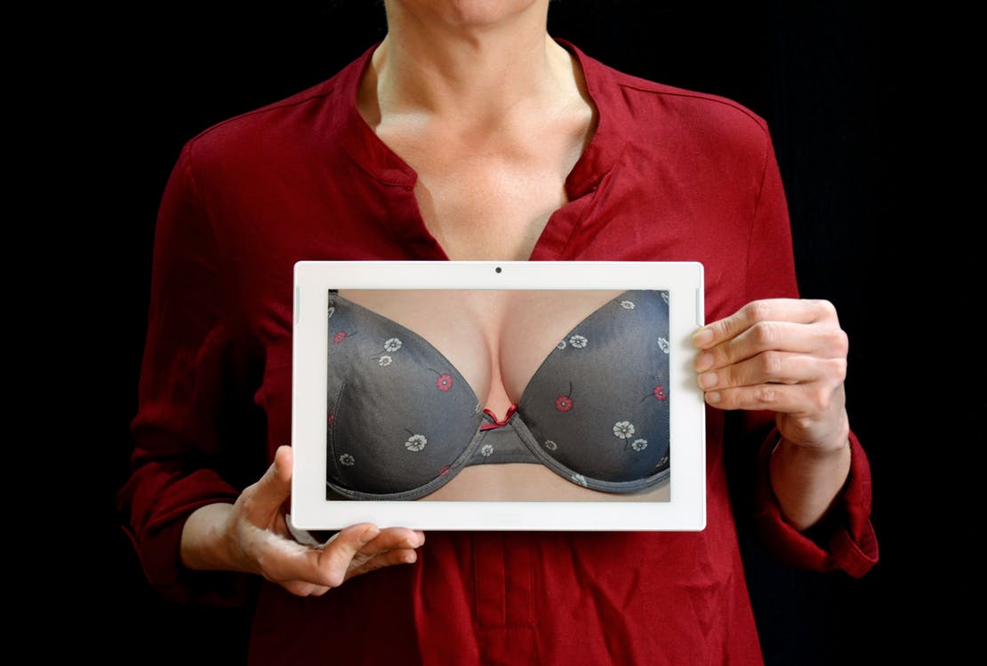 woman holding bra picture